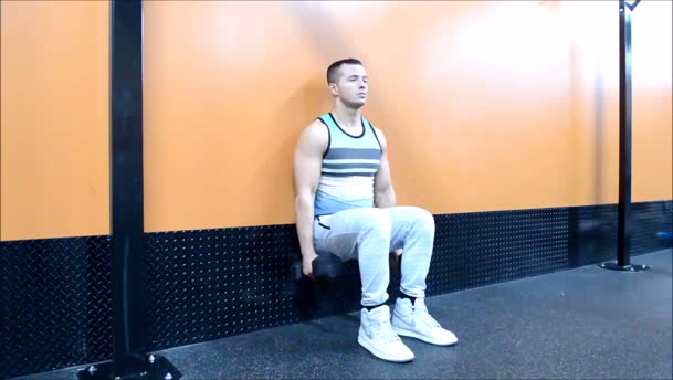 Weighted Wall Squats exercise demo