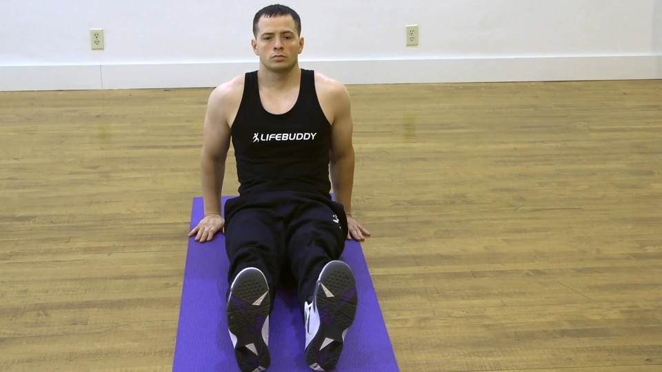 Seated Knee Over Tuck exercise demo